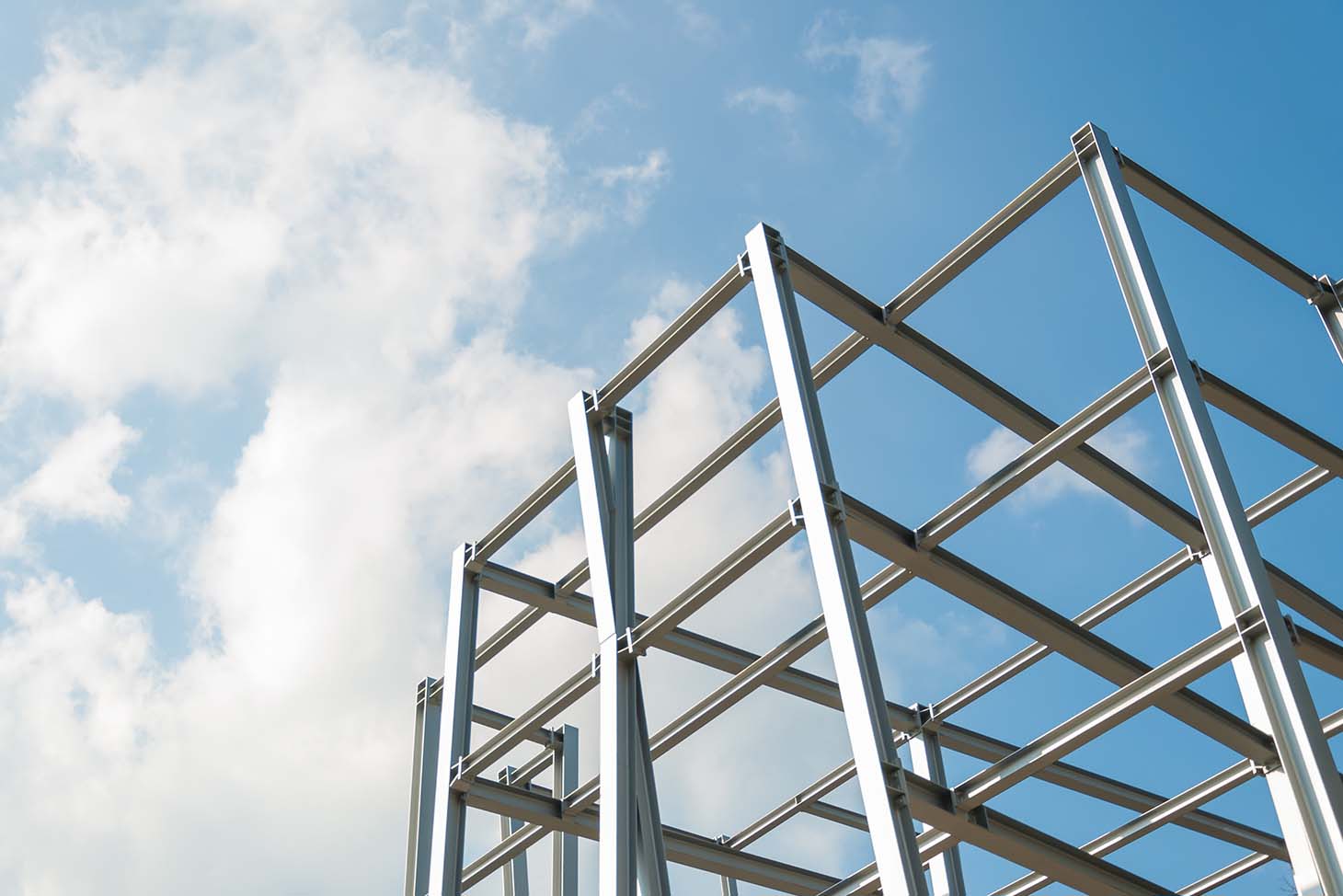 steel building with clouds