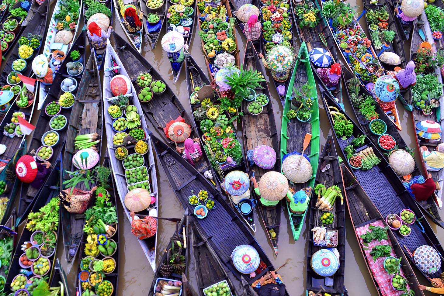 colourful boats with fruit